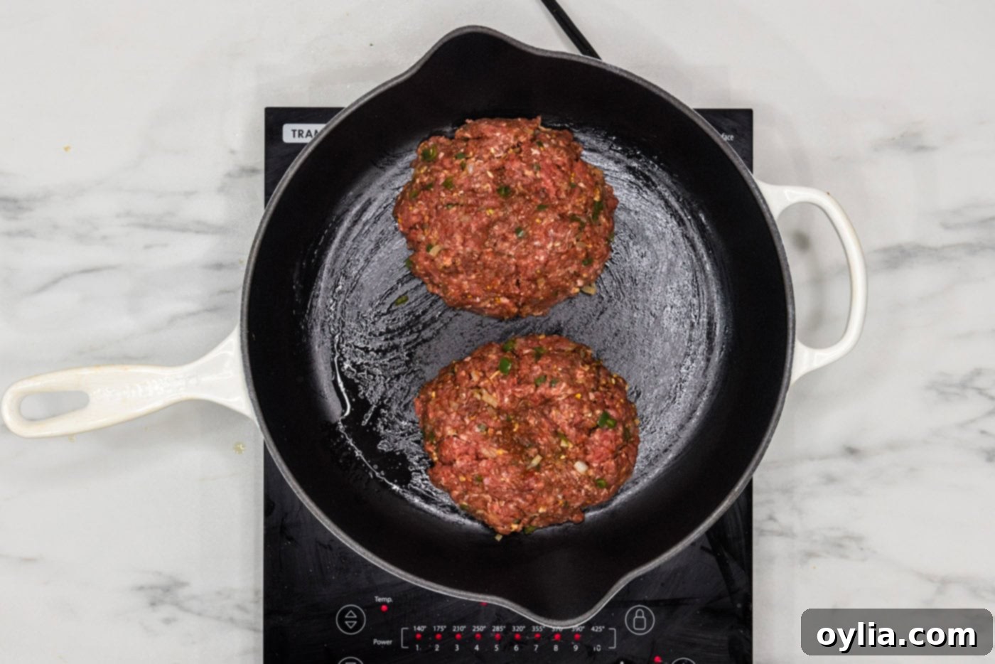 burger patties in a skillet