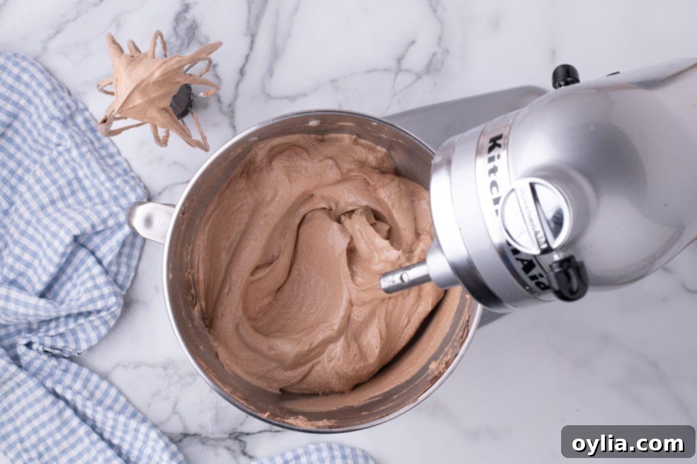 The fully prepared French silk filling, appearing incredibly smooth, light, and airy in the stand mixer bowl, ready for assembly.