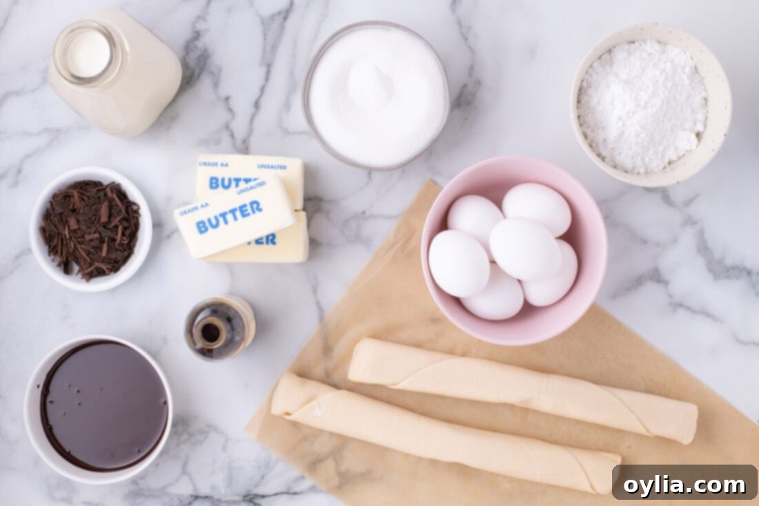 A colorful array of ingredients for French Silk Slab Pie, including baking chocolate, sticks of butter, eggs, and a pie crust package, neatly arranged on a counter.