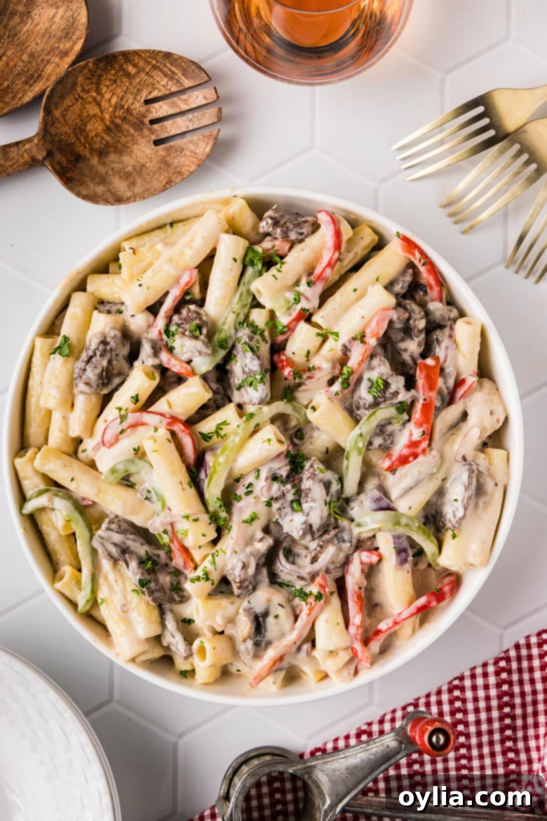 Close-up of a bowl of creamy Philly Cheesesteak Pasta, garnished with fresh parsley.