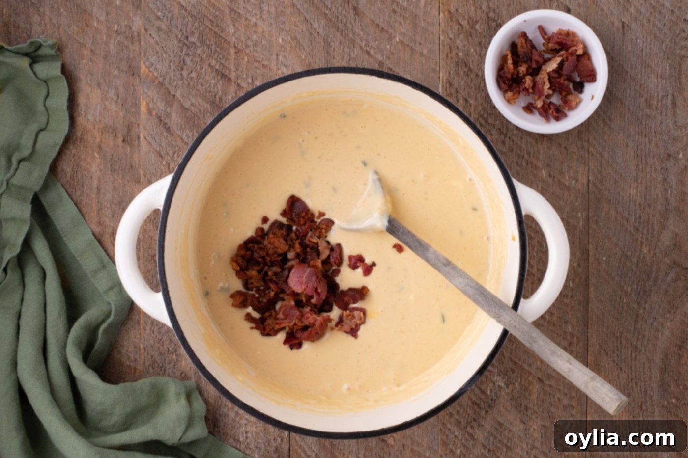 crumbled bacon mixed into jalapeno cheese sauce