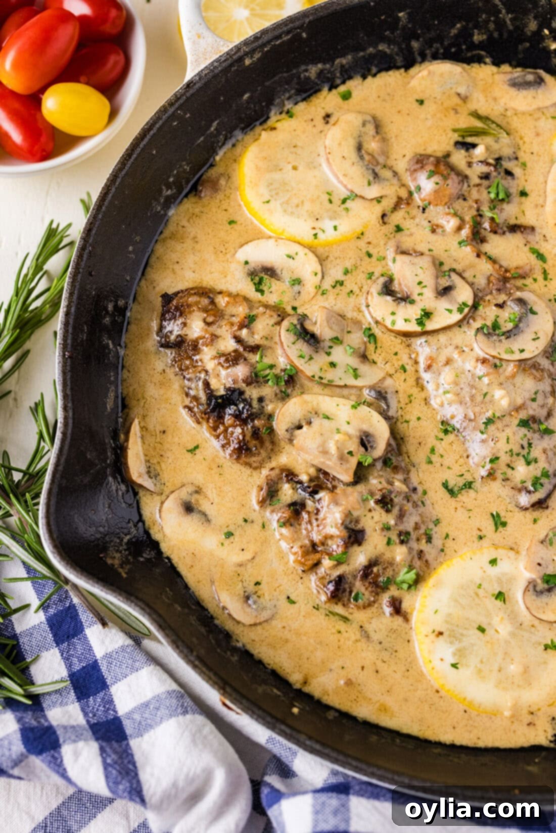 Close up photo of a skillet of Veal Scallopini