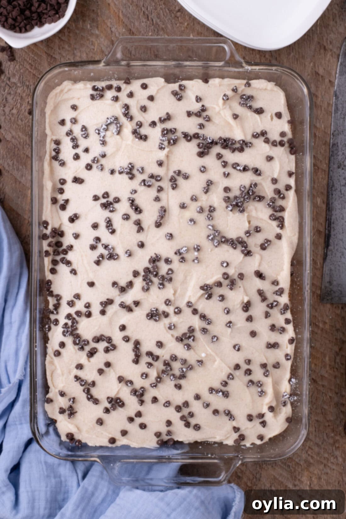Overhead shot of an entire Cannoli Poke Cake, beautifully garnished and ready to be served