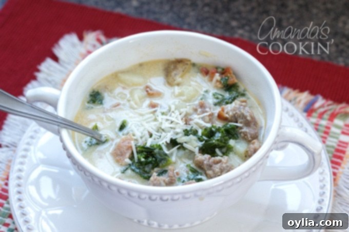 A bowl of Zuppa Toscana soup on a white table, ready to be served