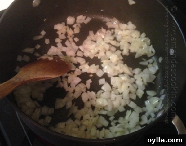 Sautéing chopped onion in a Dutch oven with olive oil