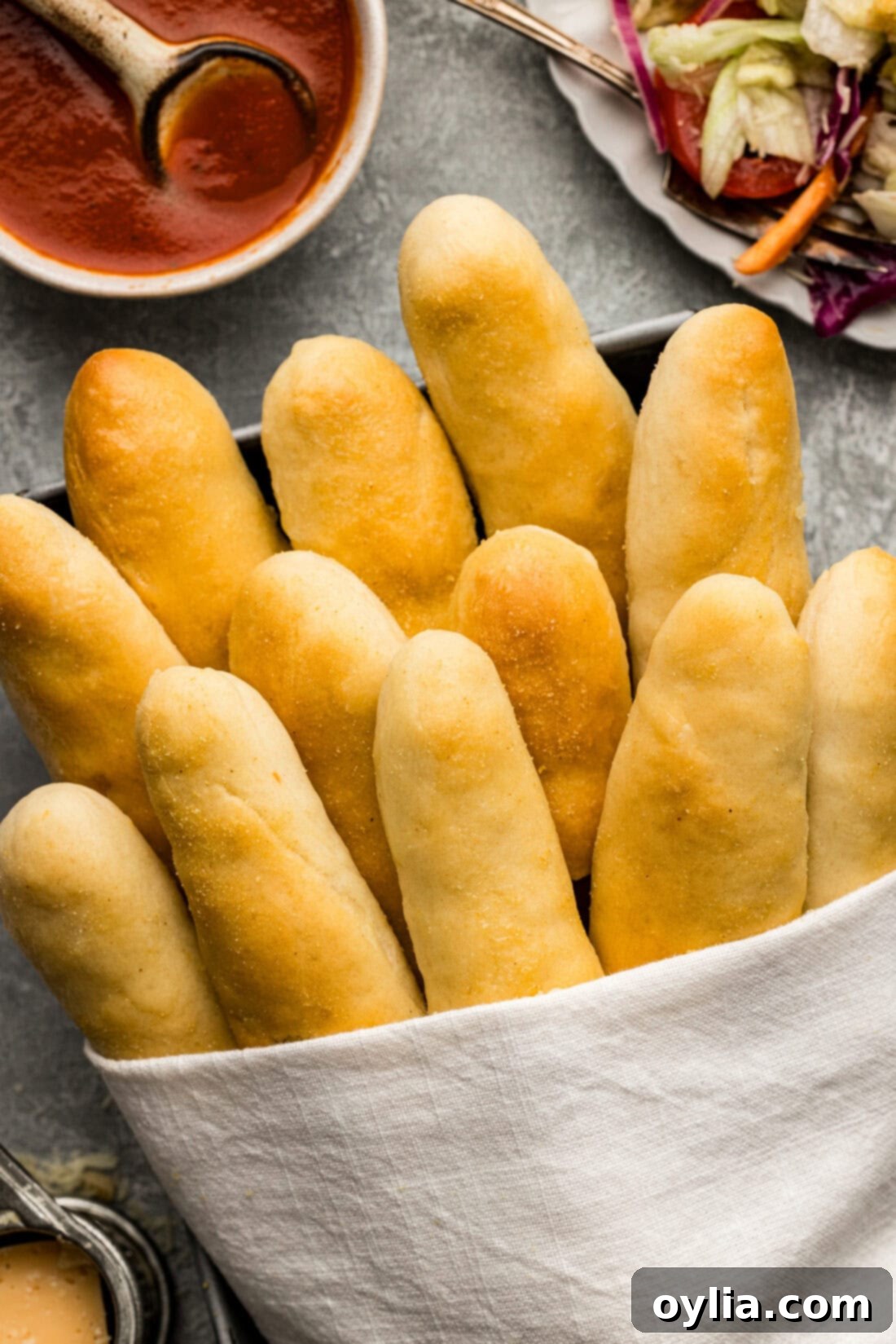 Overhead photo of Olive Garden Breadsticks wrapped in a towel