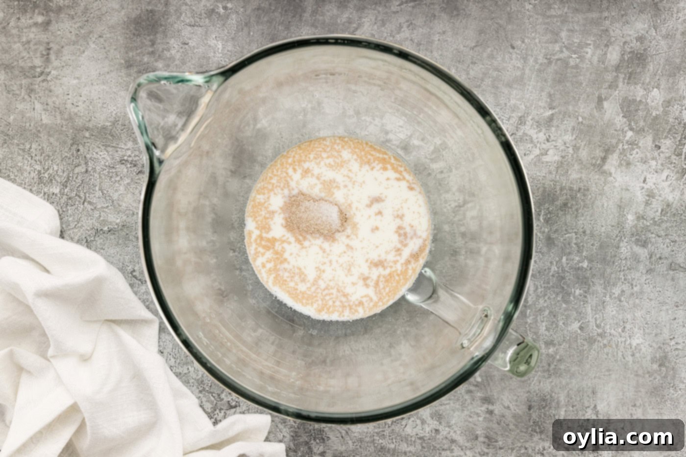 yeast over warm milk in a bowl