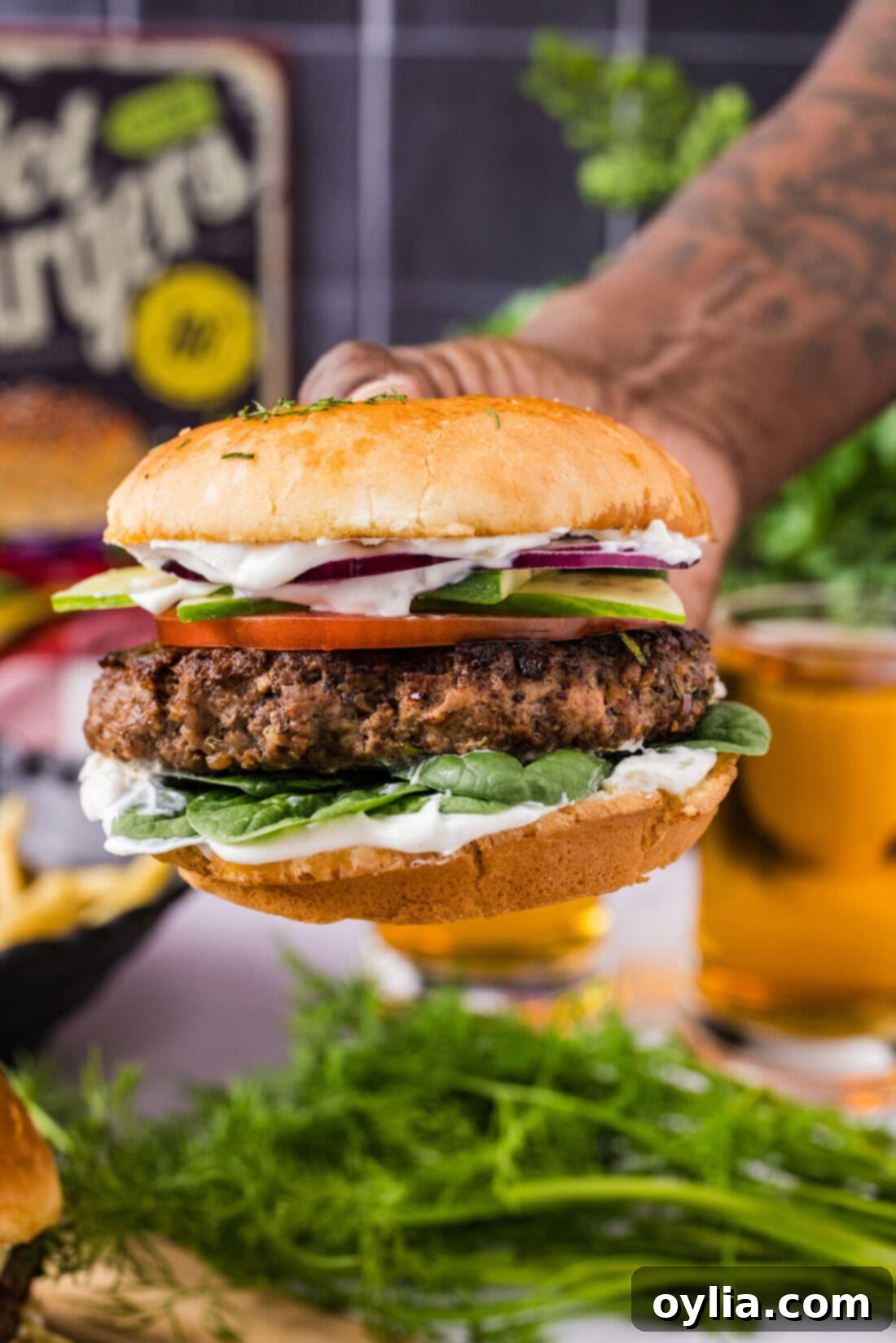 Gourmet Lamb Burgers 2 Hand holding a Lamb Burger
