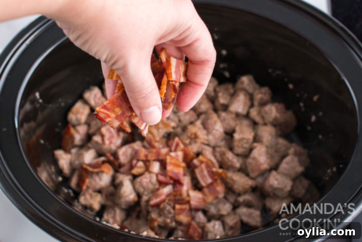 sprinkling bacon over beef