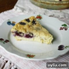 A slice of blackberry coconut impossible pie on a plate.