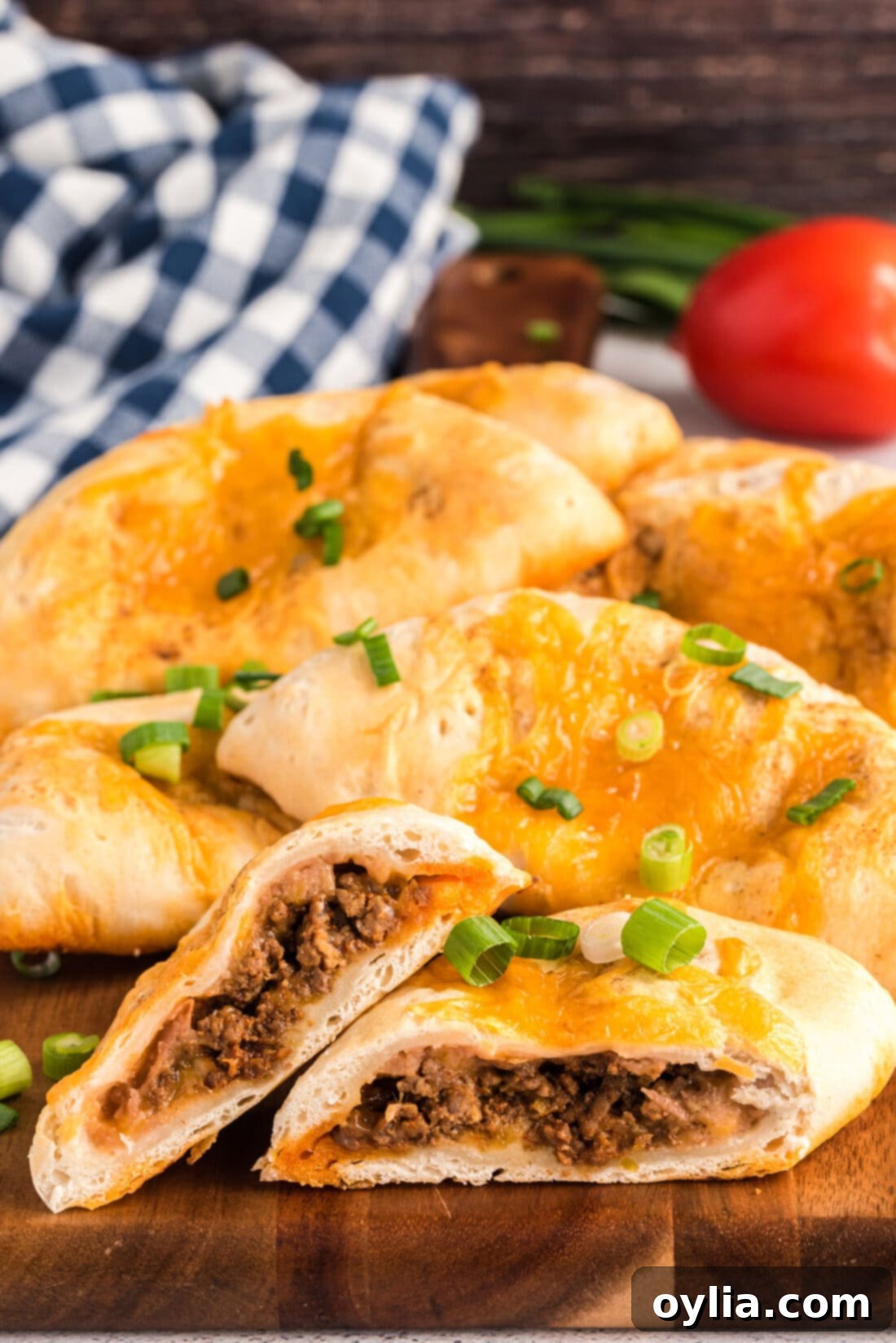 Taco Empanadas cut in half, showing the cheesy filling