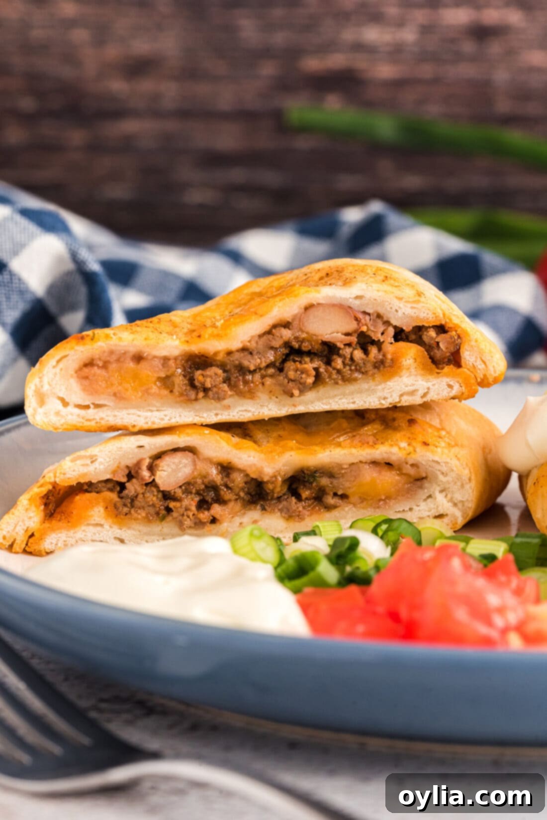 side view of cut Taco Empanadas, showing layers of filling