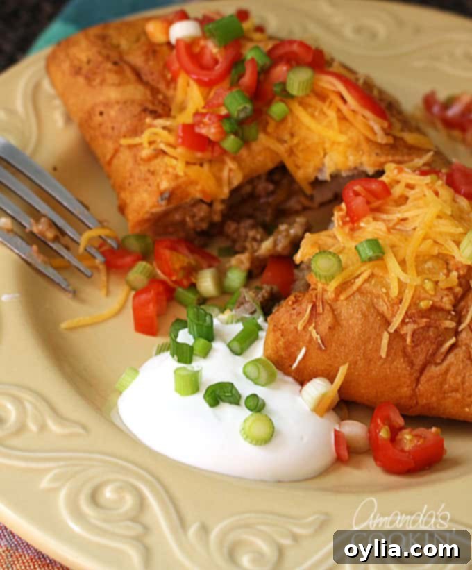 cut in half taco empanada with fresh toppings