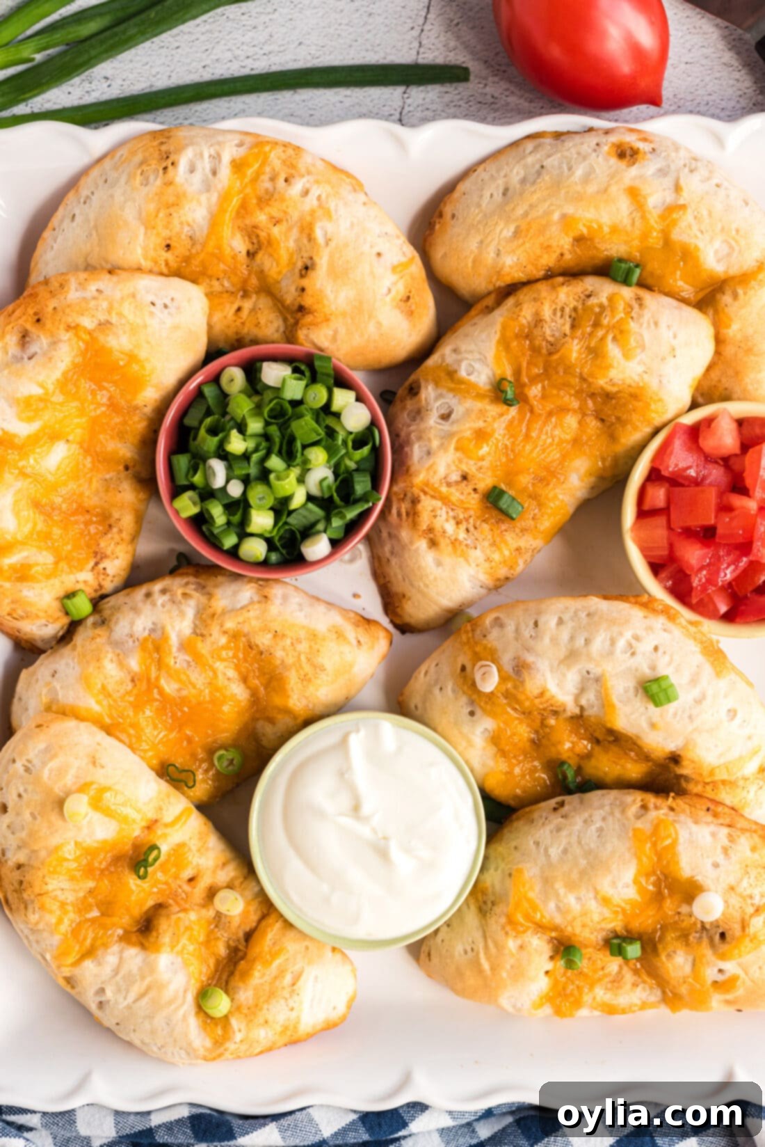 plate full of golden brown Taco Empanadas