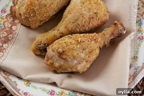 Baked oven fried chicken legs on a wire rack.