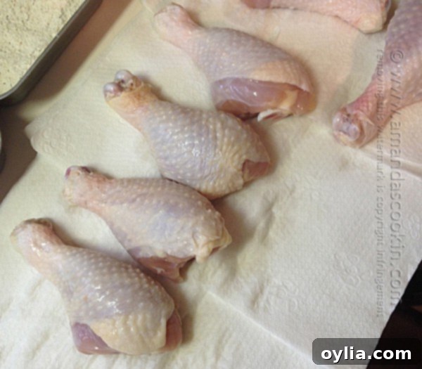 Rinsing brined chicken drumsticks.