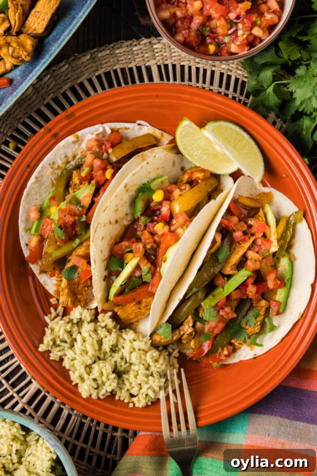 Chicken Fajitas wrapped in tortillas on a plate