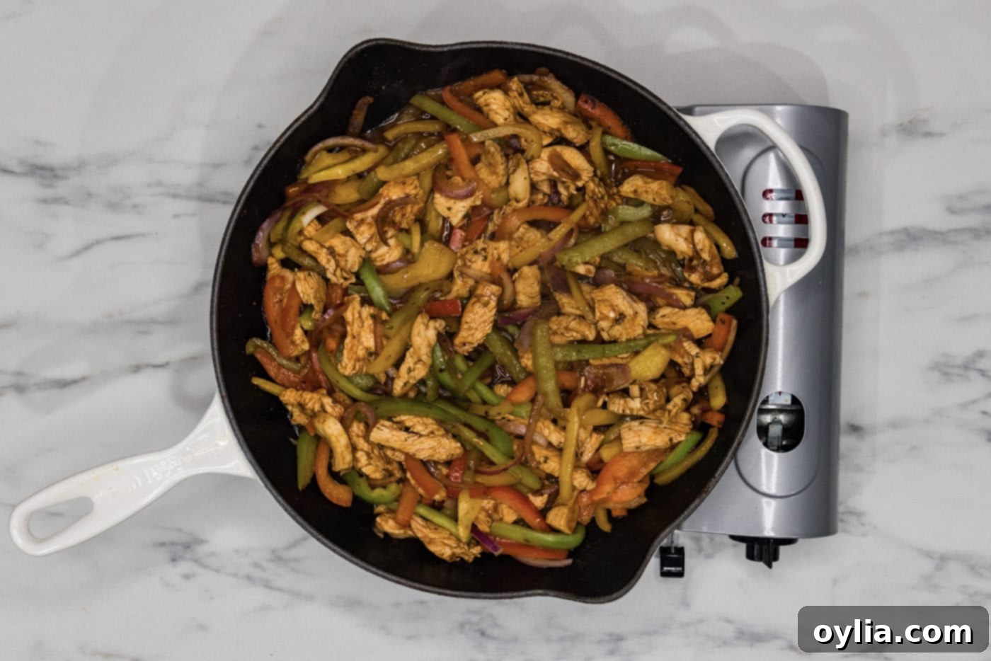 chicken fajitas in a cast iron skillet