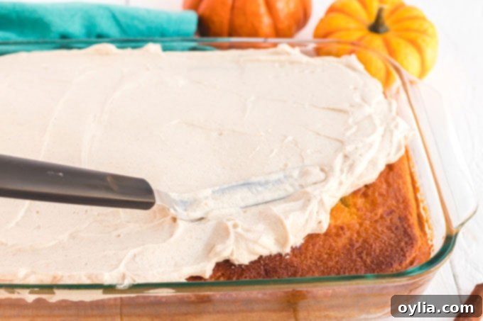 spreading icing on cake