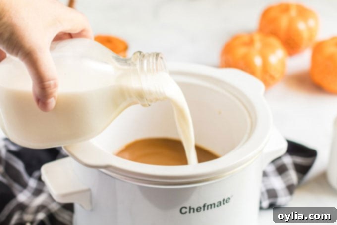 pouring milk into slow cooker