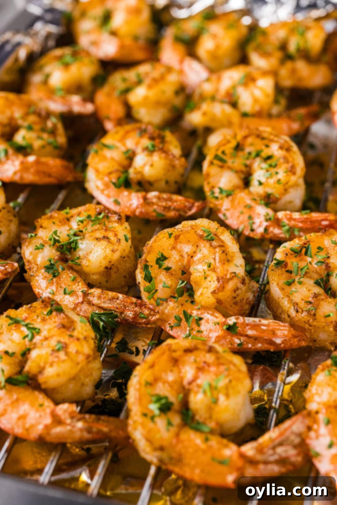 Broiled shrimp cooling on a wire rack, ready to be served or added to a dish