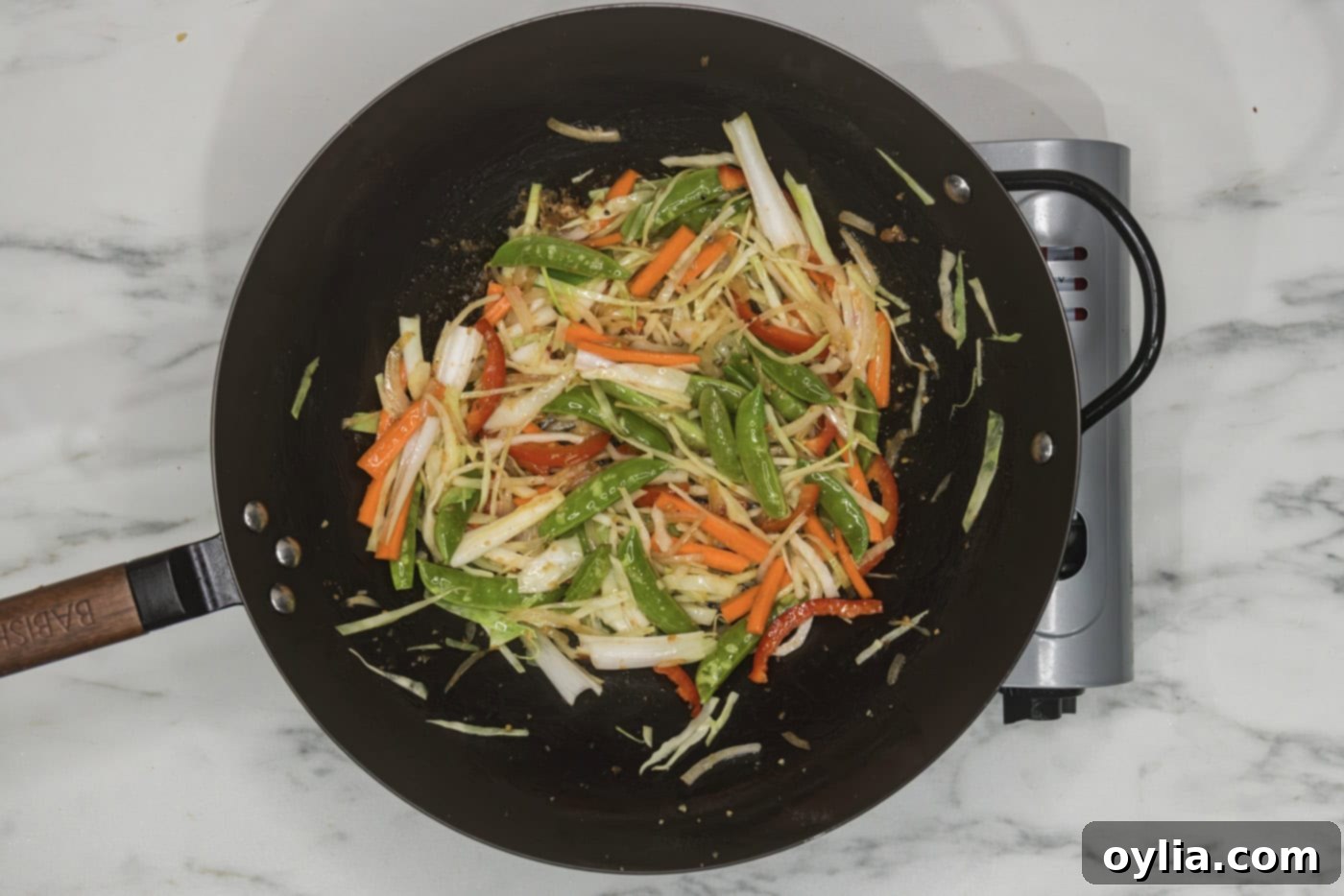 stir fry veggies in a wok