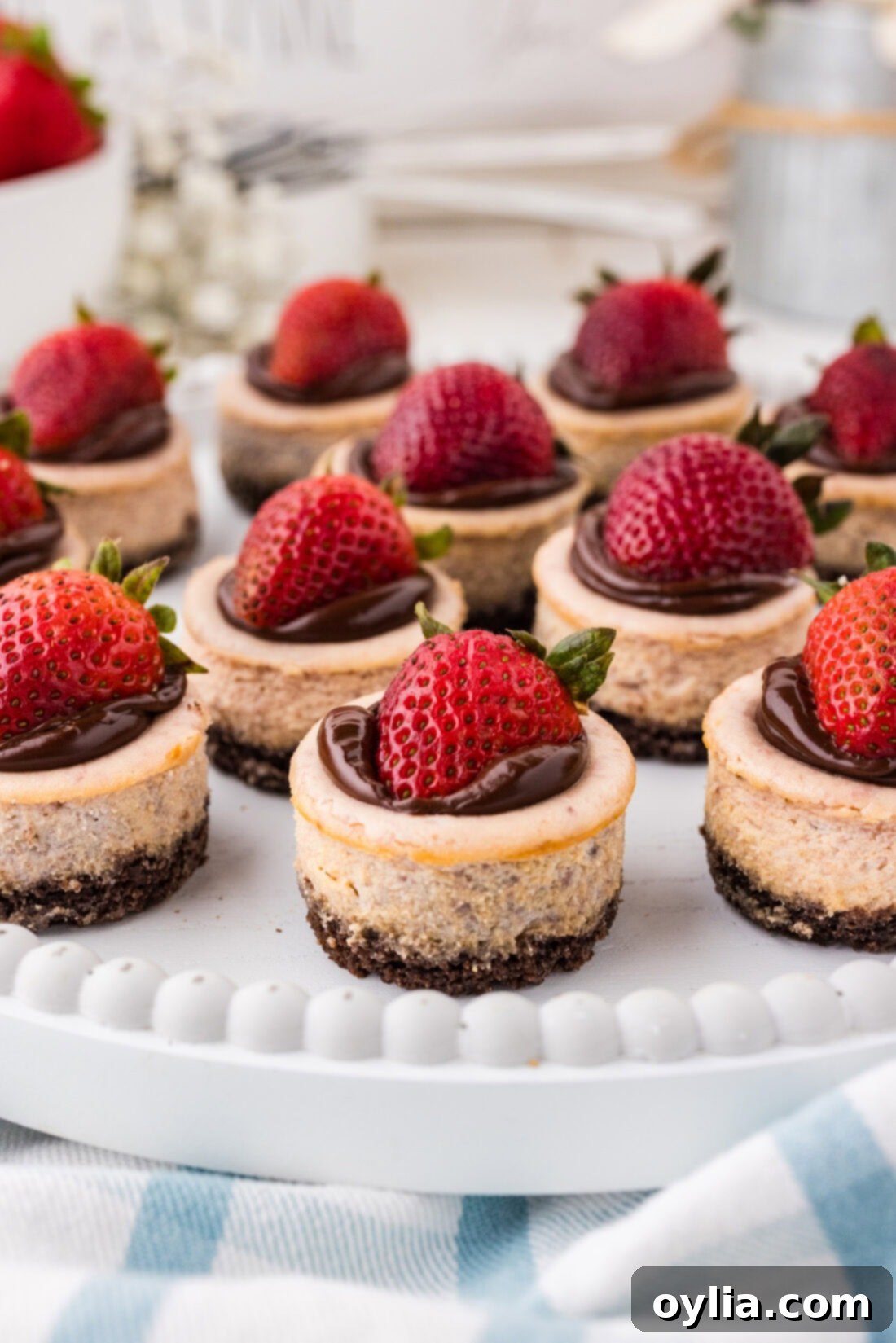 Mini Strawberry Cheesecakes on a white platter