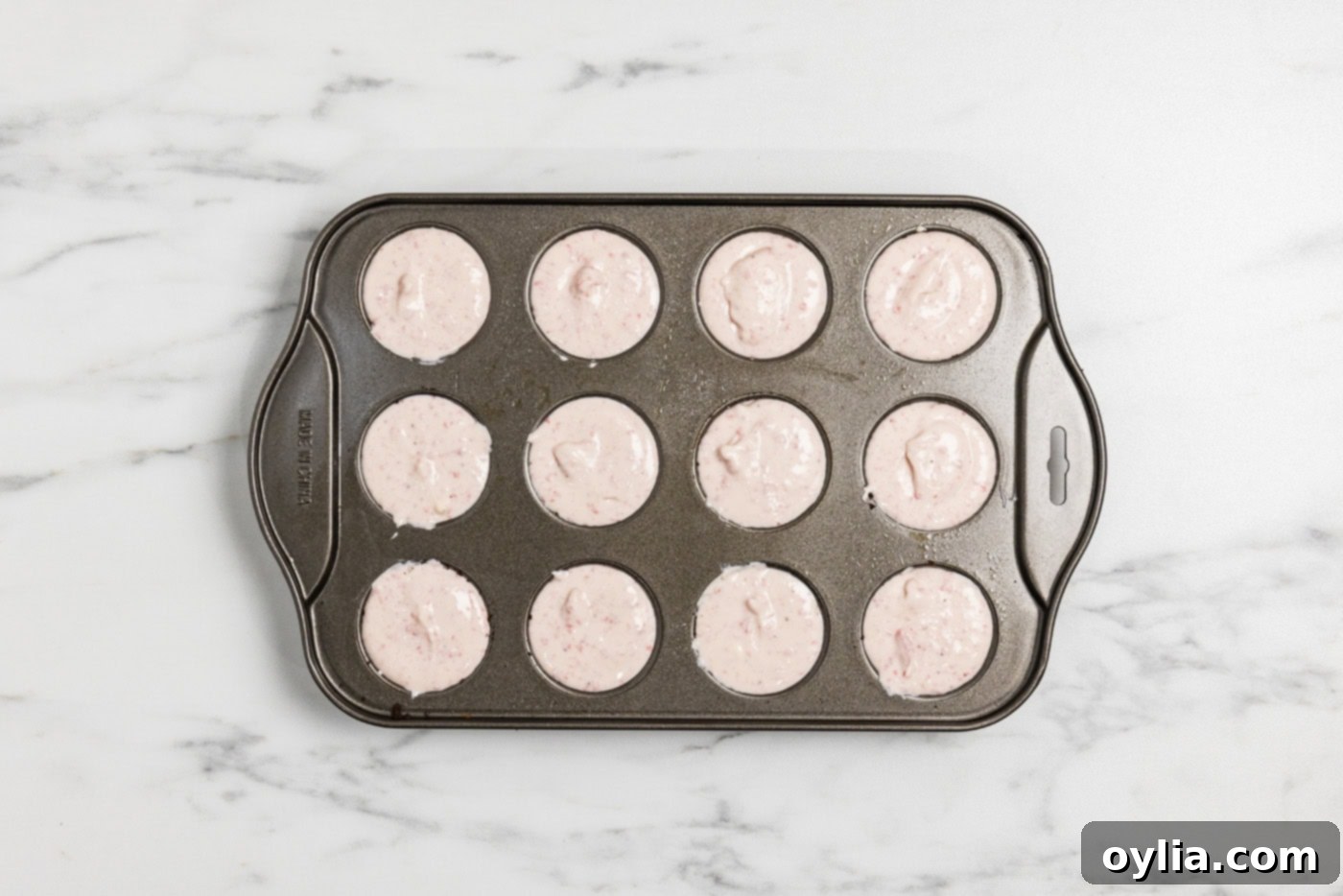 mini strawberry cheesecakes in a pan