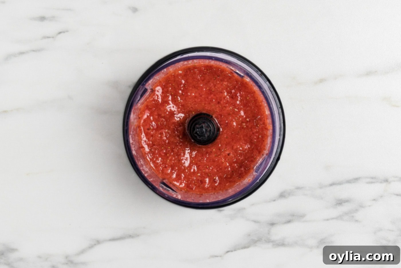 macerated strawberry mixture in a food processor