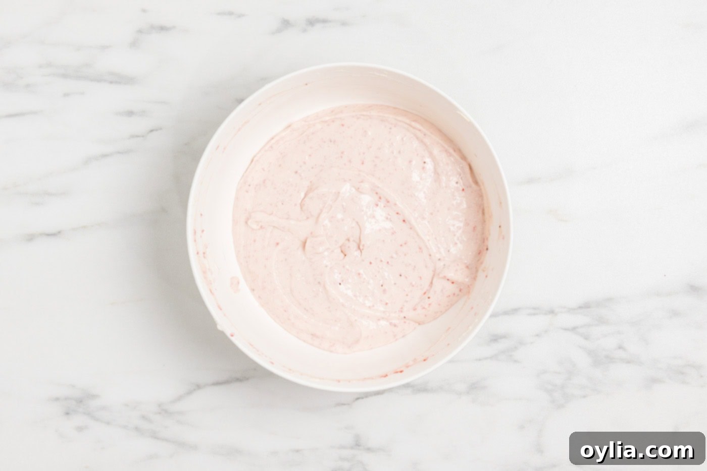strawberry cheesecake batter in a bowl