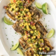Mahi Mahi Grilled to Perfection 11 Grilled Mahi Mahi on a white platter with lime wedges