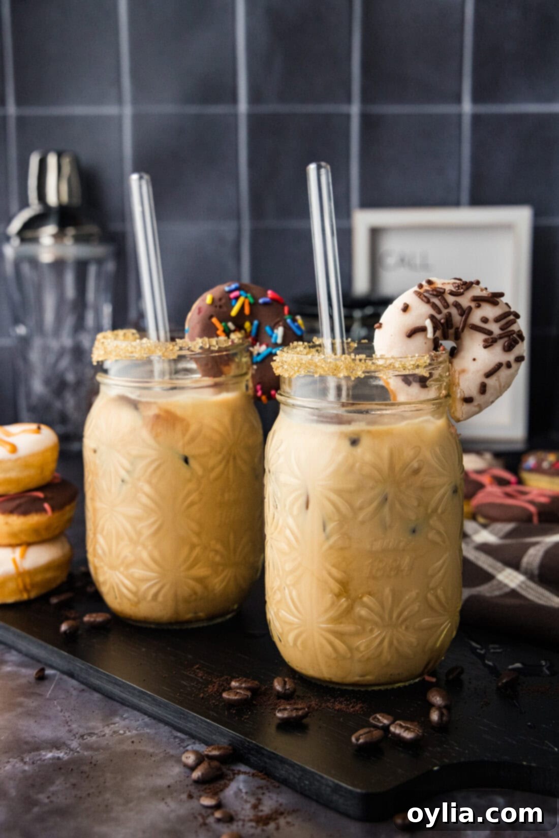 Two Iced Espresso Cocktails garnished with mini donuts