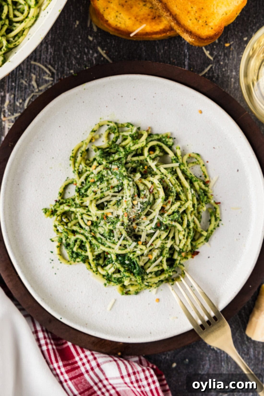 Plate of Spinach Spaghetti with a fork resting on the side