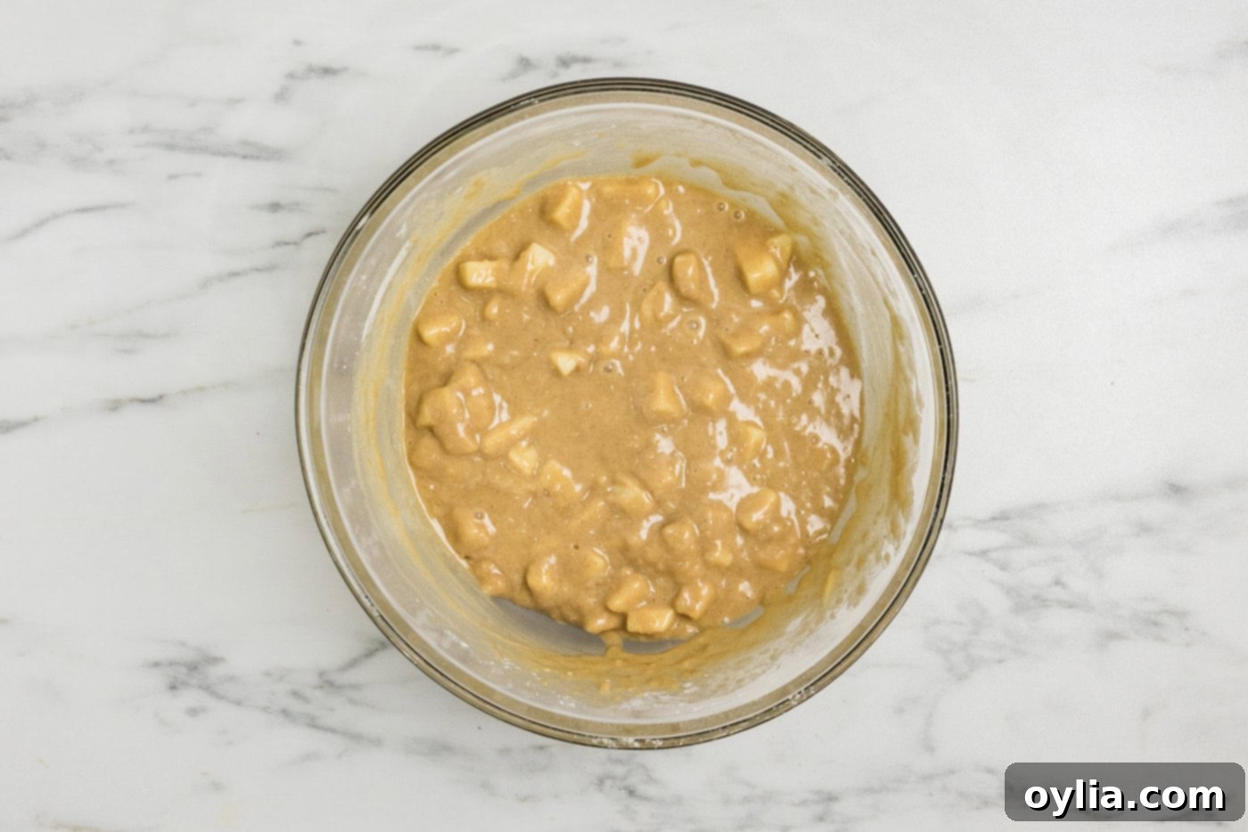 Apple muffin batter in a bowl