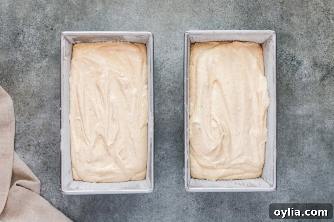 apple cider pound cake batter in loaf pans