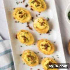 Close up photo of Fried Deviled Eggs on a white platter