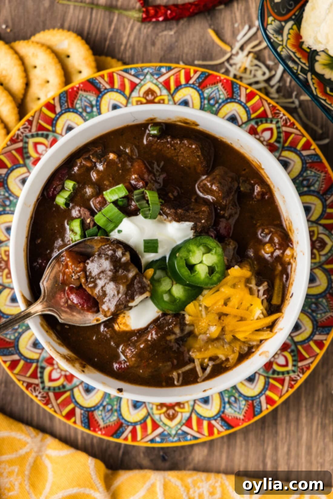 Hearty Short Rib Chili 3 Bowl of Short Rib Chili with a spoon in it