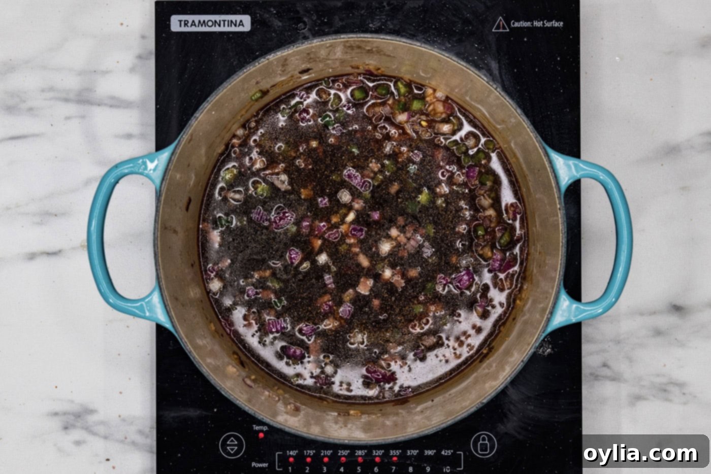 red wine added to dutch oven with sauteed vegetables