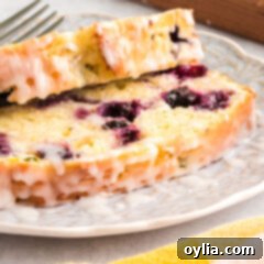 Sliced Lemon Blueberry Zucchini Bread with glaze in a recipe card format