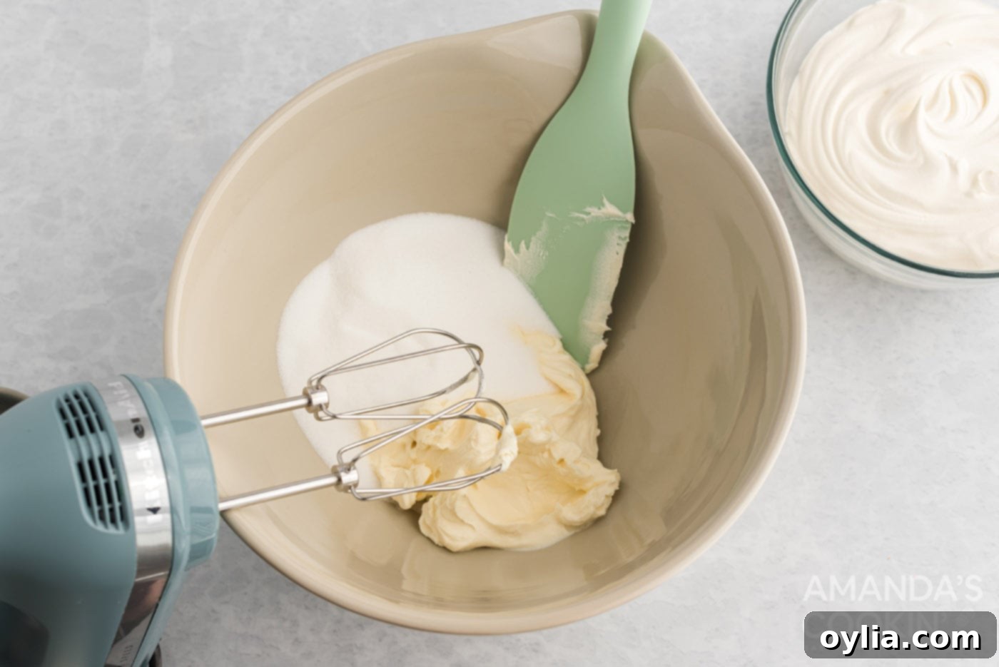 sugar and cream cheese in a mixing bowl
