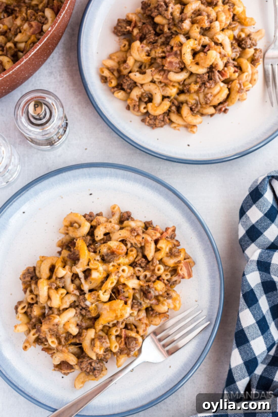 A serving of Bacon Cheeseburger Casserole plated beautifully, showcasing the pasta, beef, bacon, and melted cheese