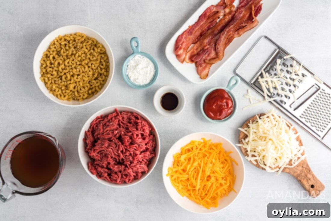 A selection of fresh ingredients laid out for Bacon Cheeseburger Casserole, including ground beef, elbow macaroni, bacon, various cheeses, and sauce components