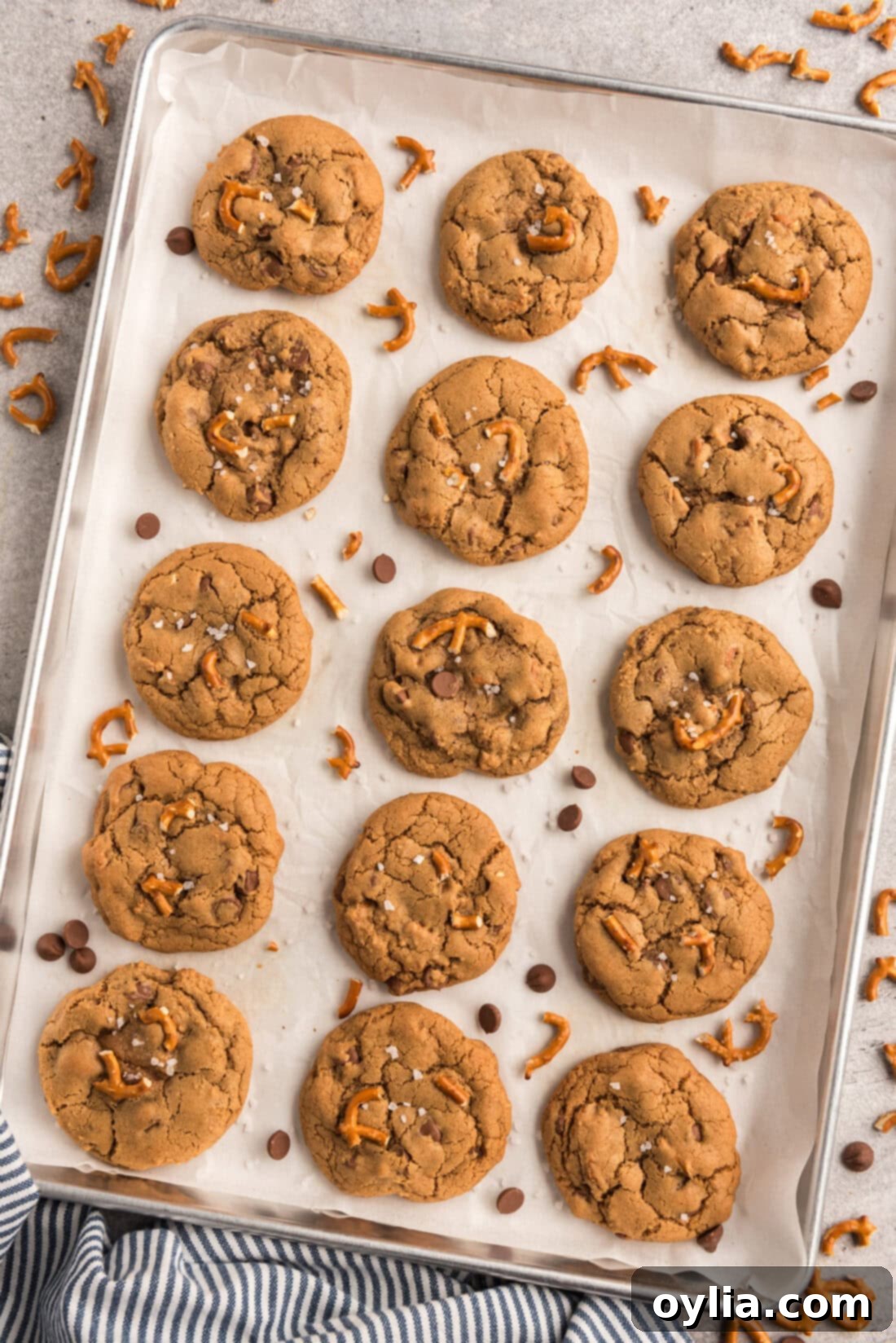 A pan of freshly baked Pretzel Chocolate Chip Cookies, still warm and golden brown, ready to be enjoyed.