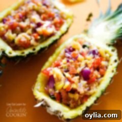 A photo of pineapple salsa served in halved pineapples.