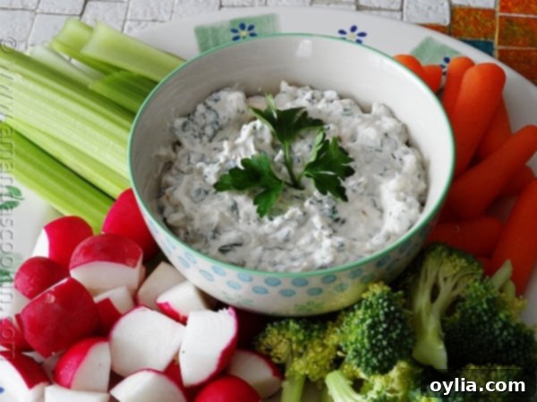 Cheesy Pesto Dip at AmandasCookin.com @amandaformaro