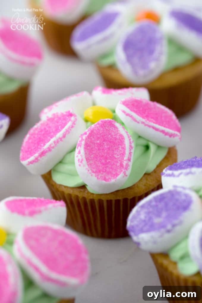 A close up of a marshmallow flower cupcakes.