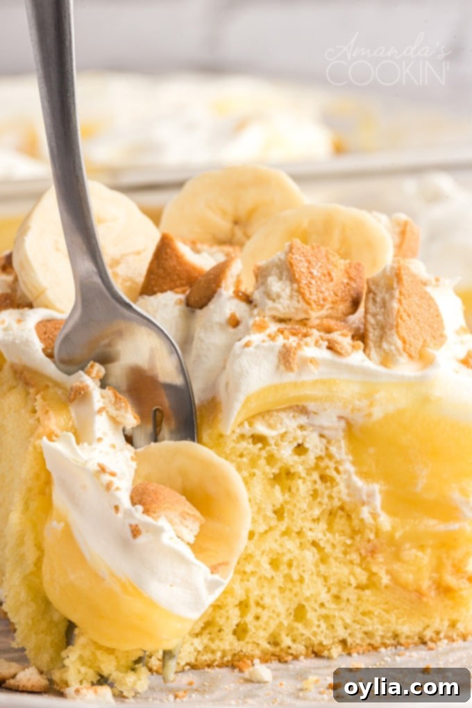 fork taking a slice of banana pudding poke cake