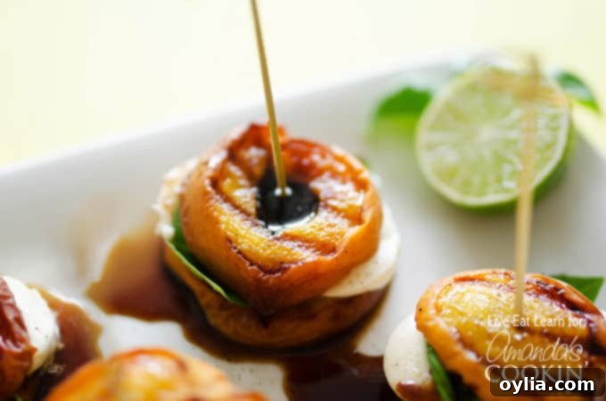 A close up of grilled peach caprese.