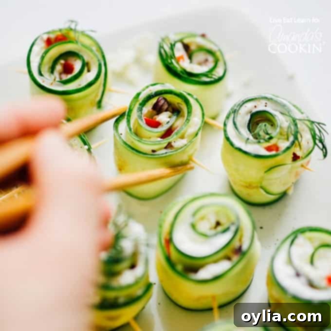picking up cucumber sushi with chopsticks