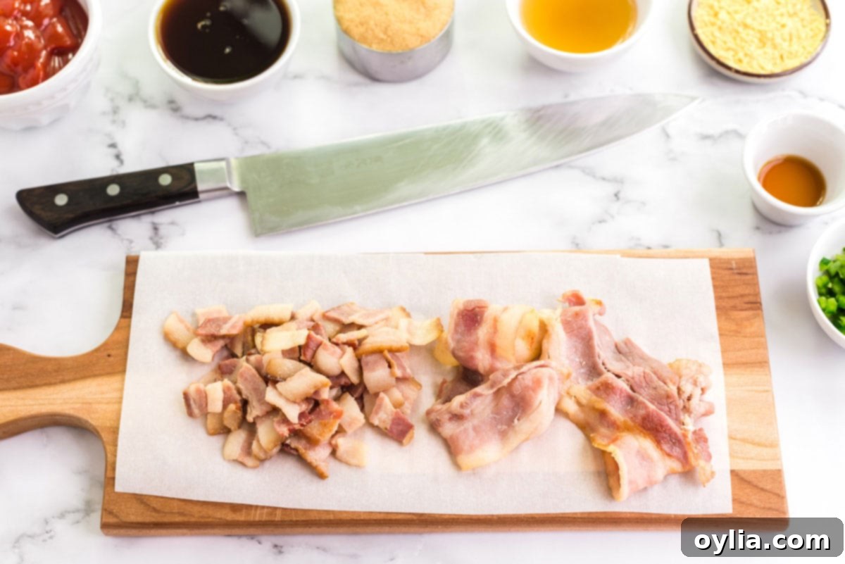 Perfectly Homemade Baked Beans 3 Partially cooked thick-cut bacon strips resting on a cutting board, ready for chopping.